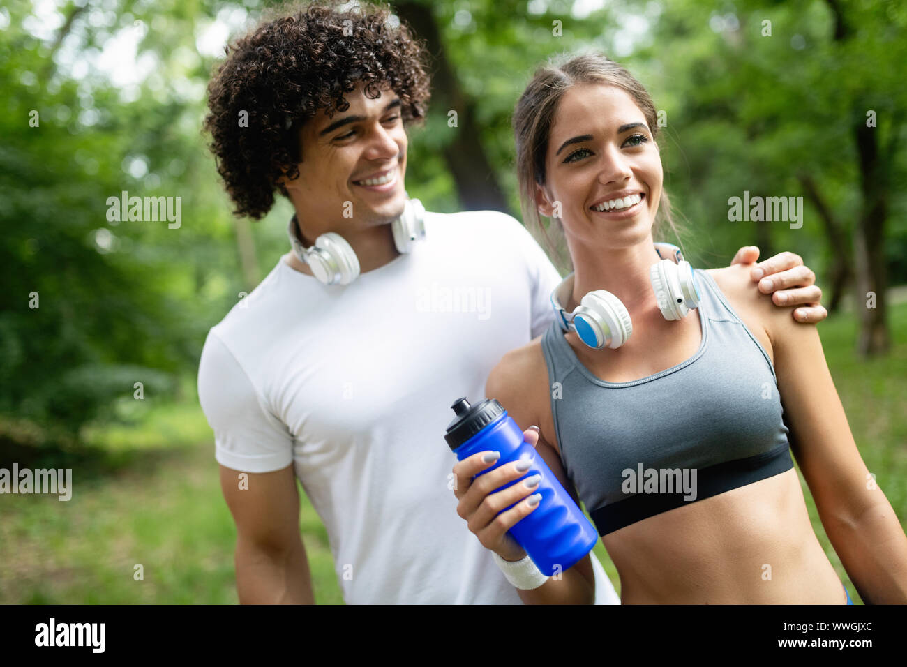 Couple jogging and running outdoors in nature Stock Photo - Alamy