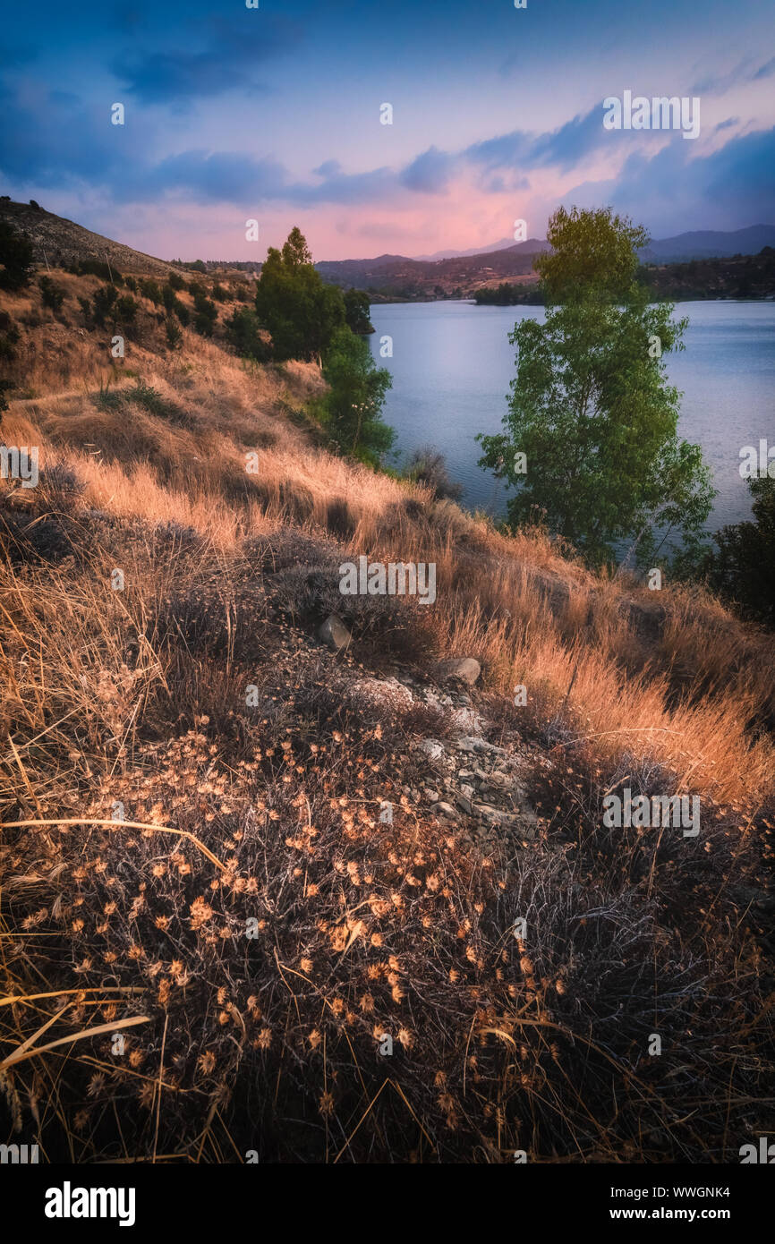 Tamassos Reservoir (water dam) in Nicosia area, Cyprus on a sunset Stock Photo