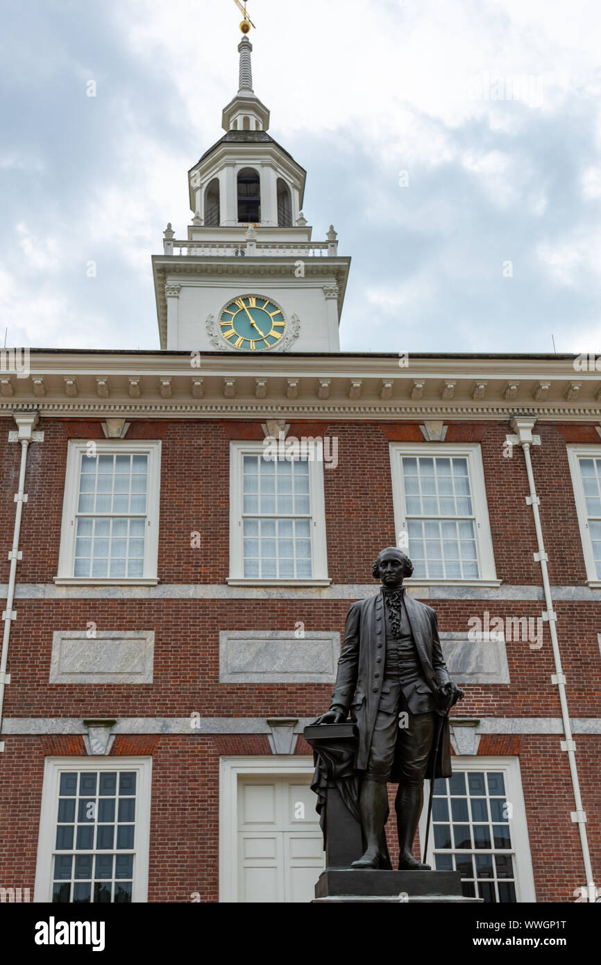 Joseph A Bailly's statue of George Washington in front of the steeple, spire and red brick Georgian facade  of Independence Hall. Stock Photo