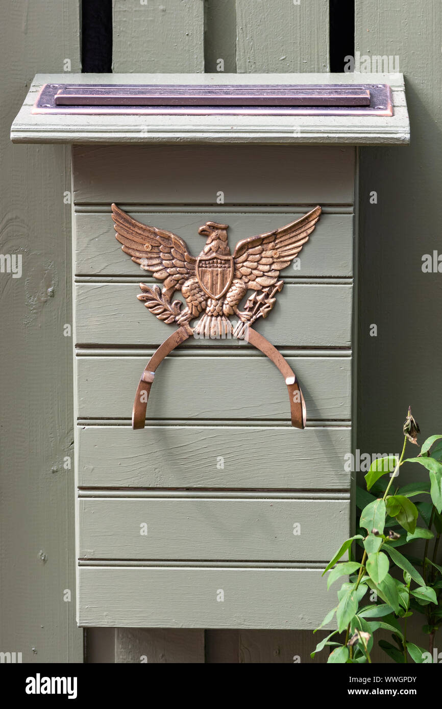 A mailbox decorated with the bald eagle from the US Great Seal, on the gate of a historic house in Elfreth's Alley, Old City.. Stock Photo