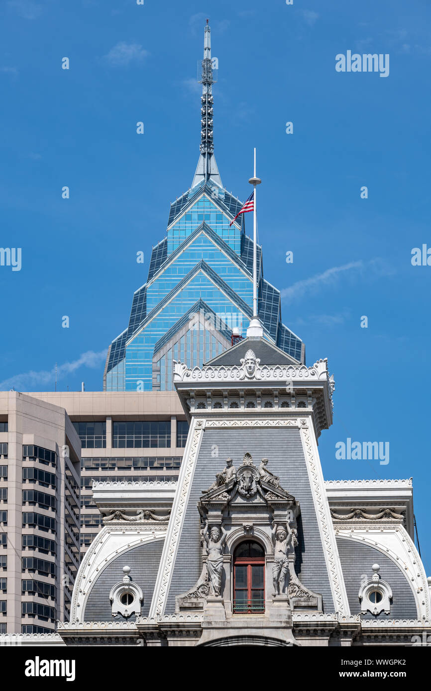The slated mansard roof of City Hall, complete with sculptures & the top of One Liberty Place, which replaced it as Philadelphia's tallest building Stock Photo