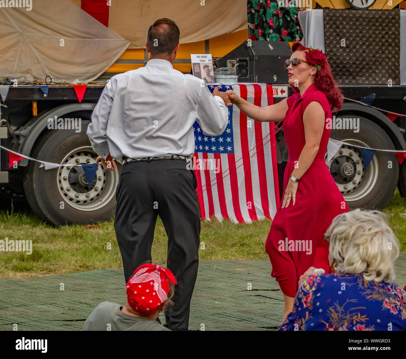 Male and female dancers giving a jive dance demonstration at the 1940s