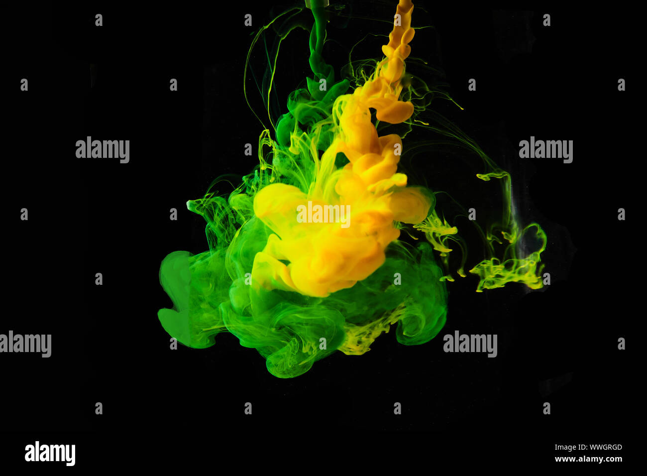 Studio shot of colored ink in water isolated on black background Stock Photo
