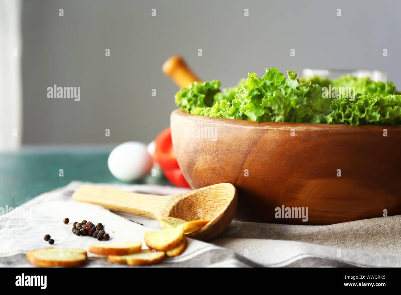 Bowl with tasty salad on table Stock Photo - Alamy