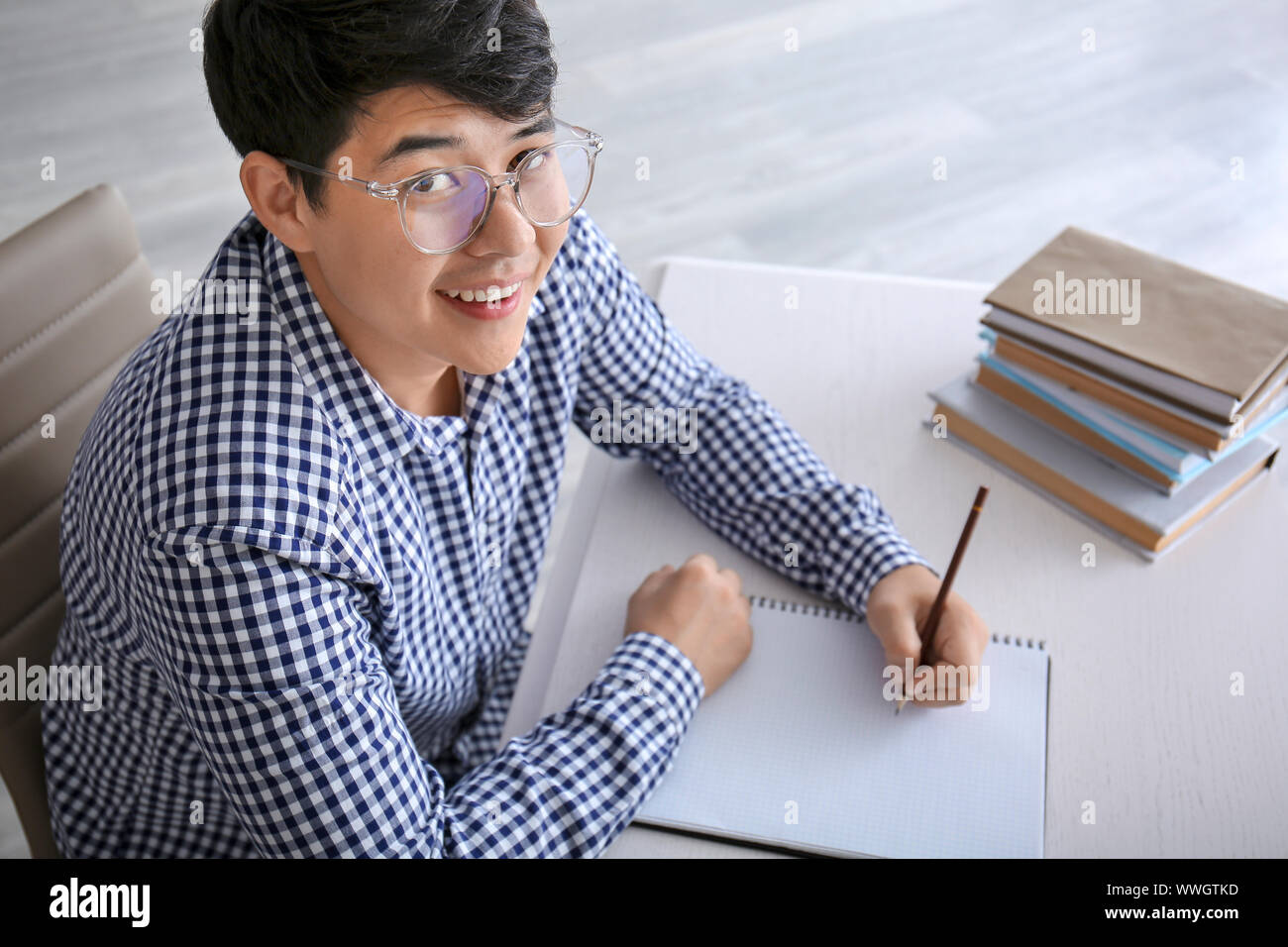 Asian student preparing for exam at home Stock Photo