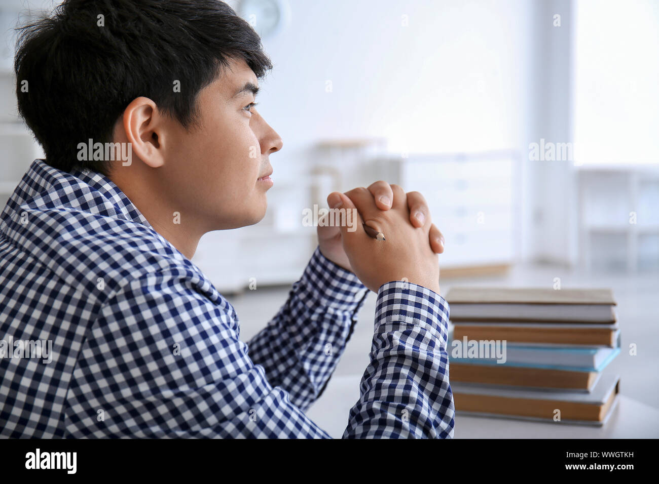 Asian student preparing for exam at home Stock Photo
