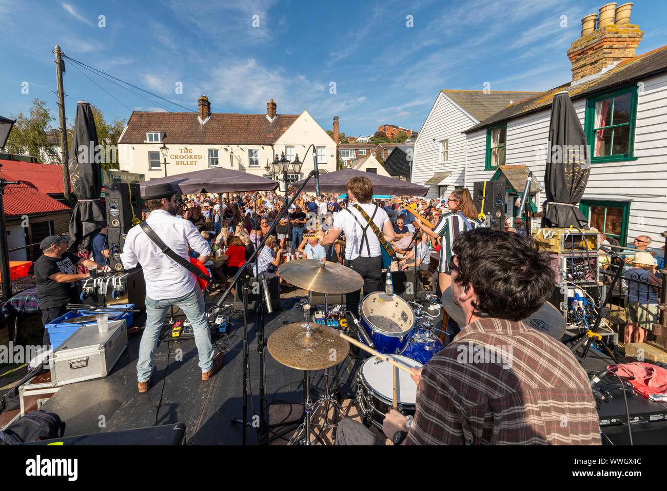 Rock band playing at the Old Leigh Regatta 2019 in Old Leigh, Leigh on Sea, Essex, UK. Crooked Billet pub and large crowd on a sunny day Stock Photo