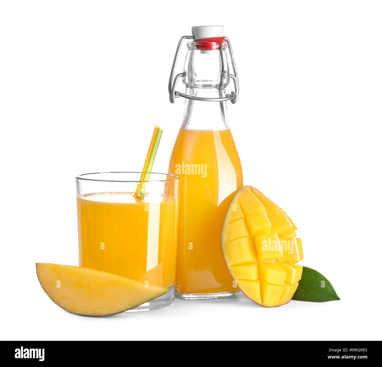Bottle and glass of tasty mango juice on white background Stock Photo -  Alamy
