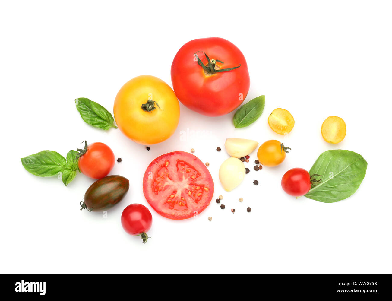 Fresh tomatoes and spices on white background Stock Photo