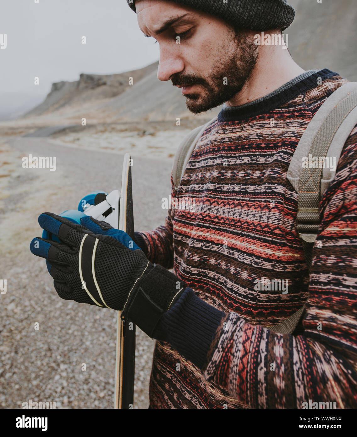 Skater traveling iceland on his longboard Stock Photo - Alamy