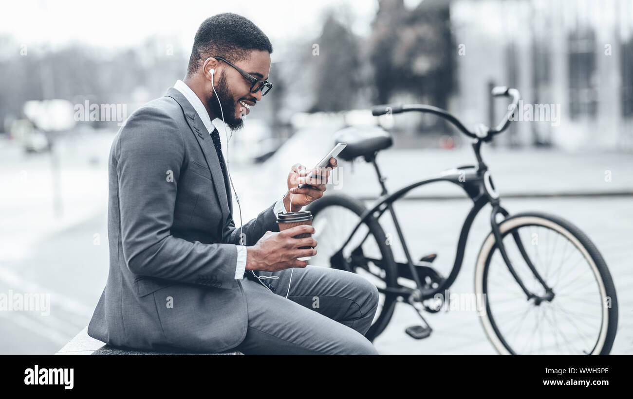 Handsome businessman browsing net during coffee break Stock Photo
