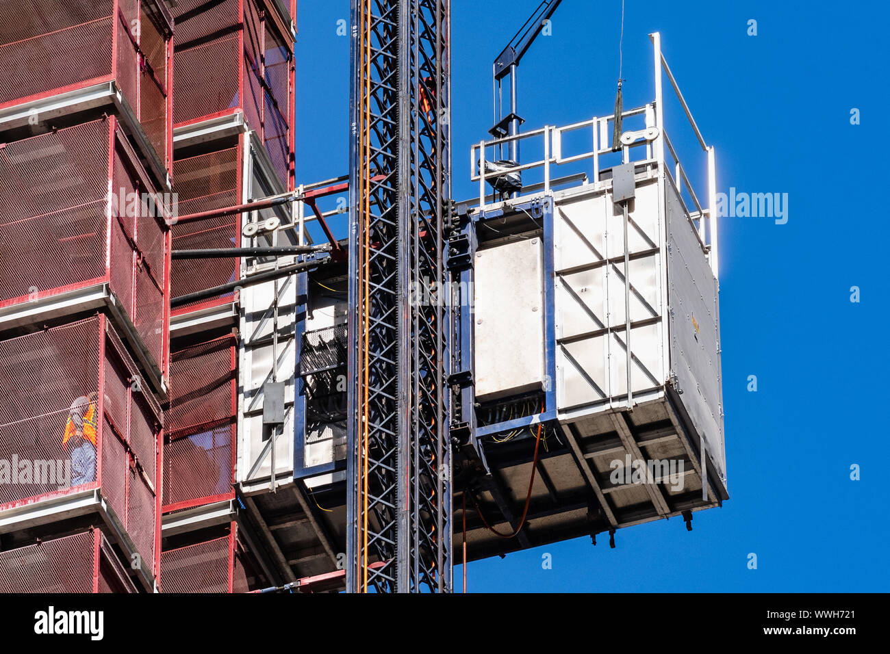Close up of industrial hoist used to lift workers and materials at a