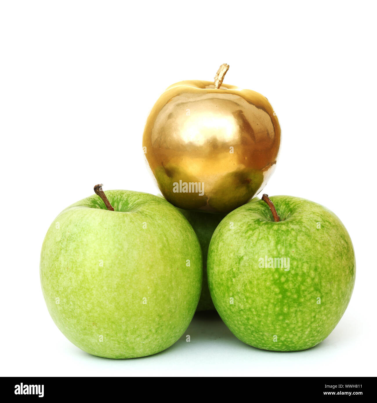 gold and green apples on white background Stock Photo