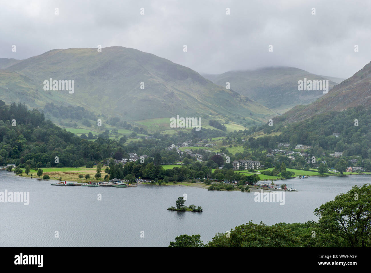 View from path of Ullswater lake between Sandwich and Patterdale East side of lake with Glenridding in the distance. Stock Photo