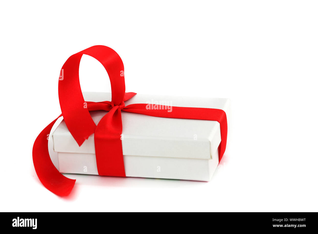 white christmas gift with red ribbon Stock Photo Alamy