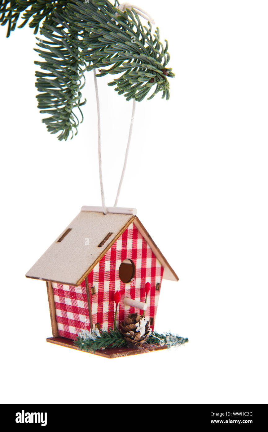 Hanging checked birdhouse in christmas tree Stock Photo - Alamy