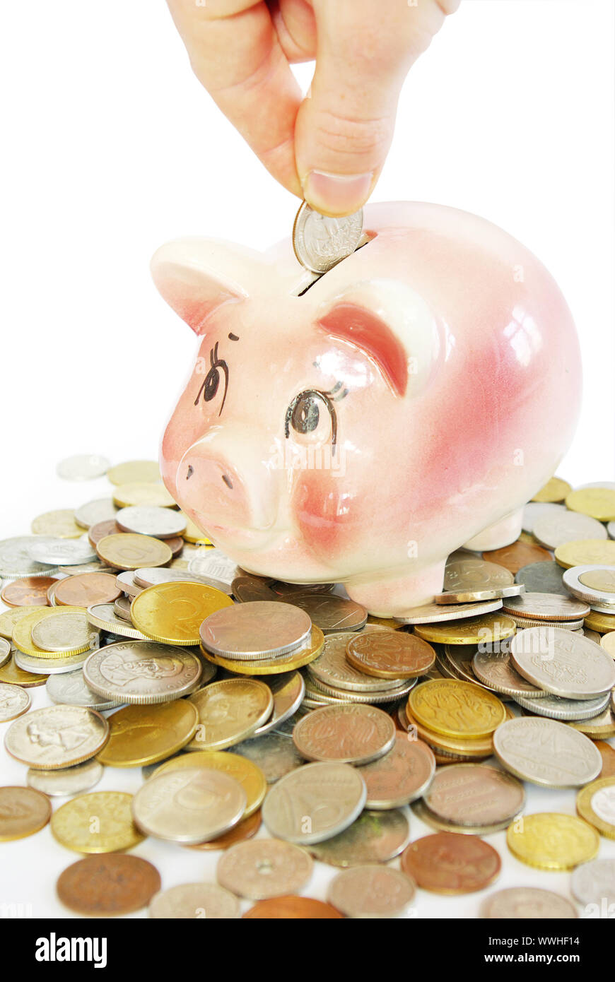 Pink piggy bank isolated on white background with coins Stock Photo - Alamy