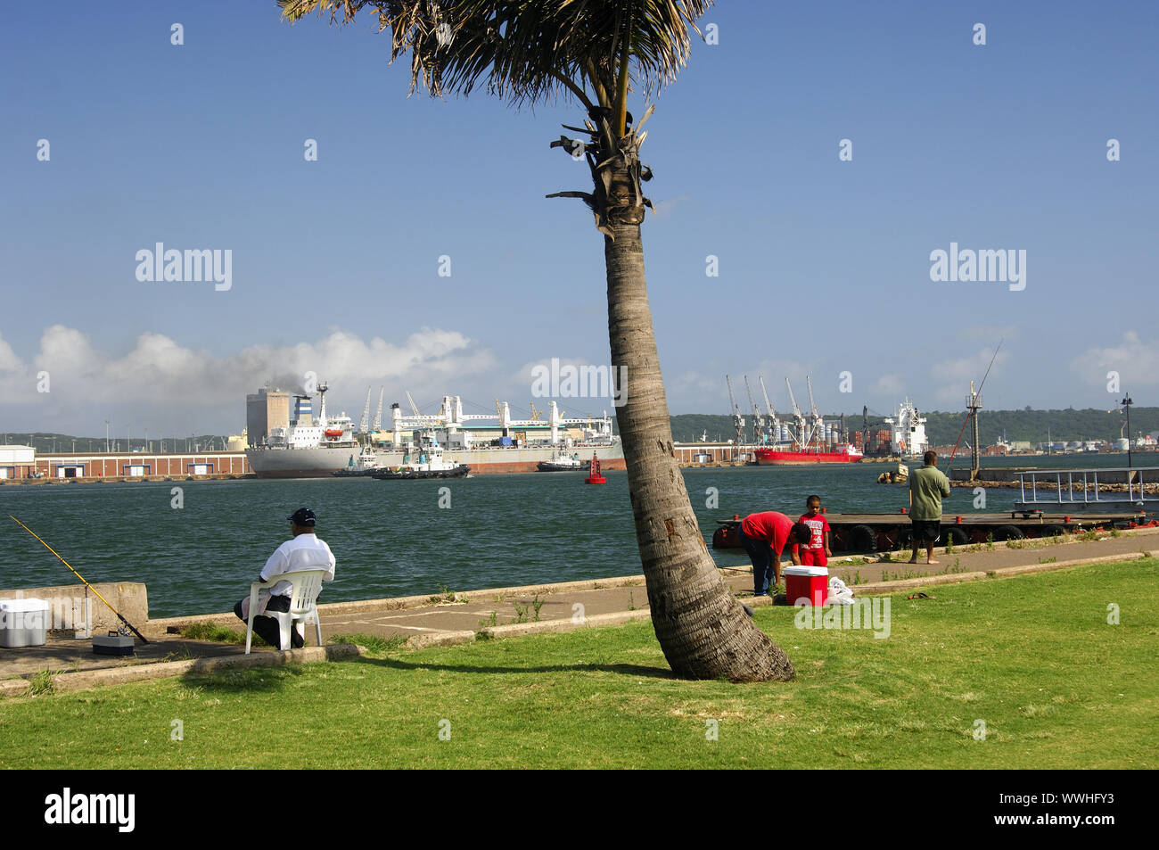 Anglers in the harbour basin of Durban Stock Photo