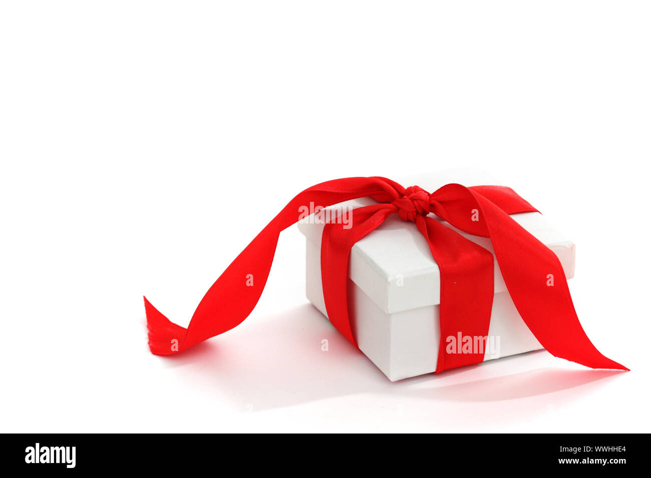 white christmas gift with red ribbon Stock Photo Alamy