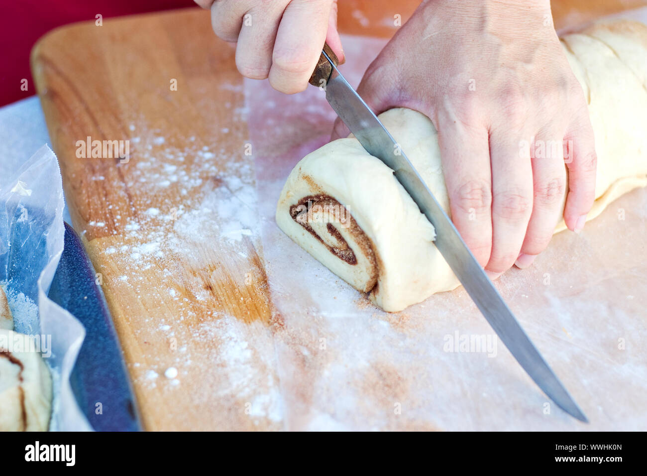 Cutting Cinnamon Roll Dough Stock Photo
