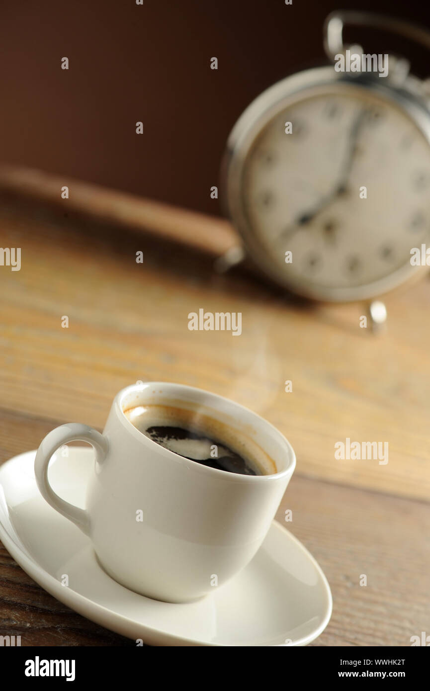 Alarm clock and coffee cup Stock Photo Alamy