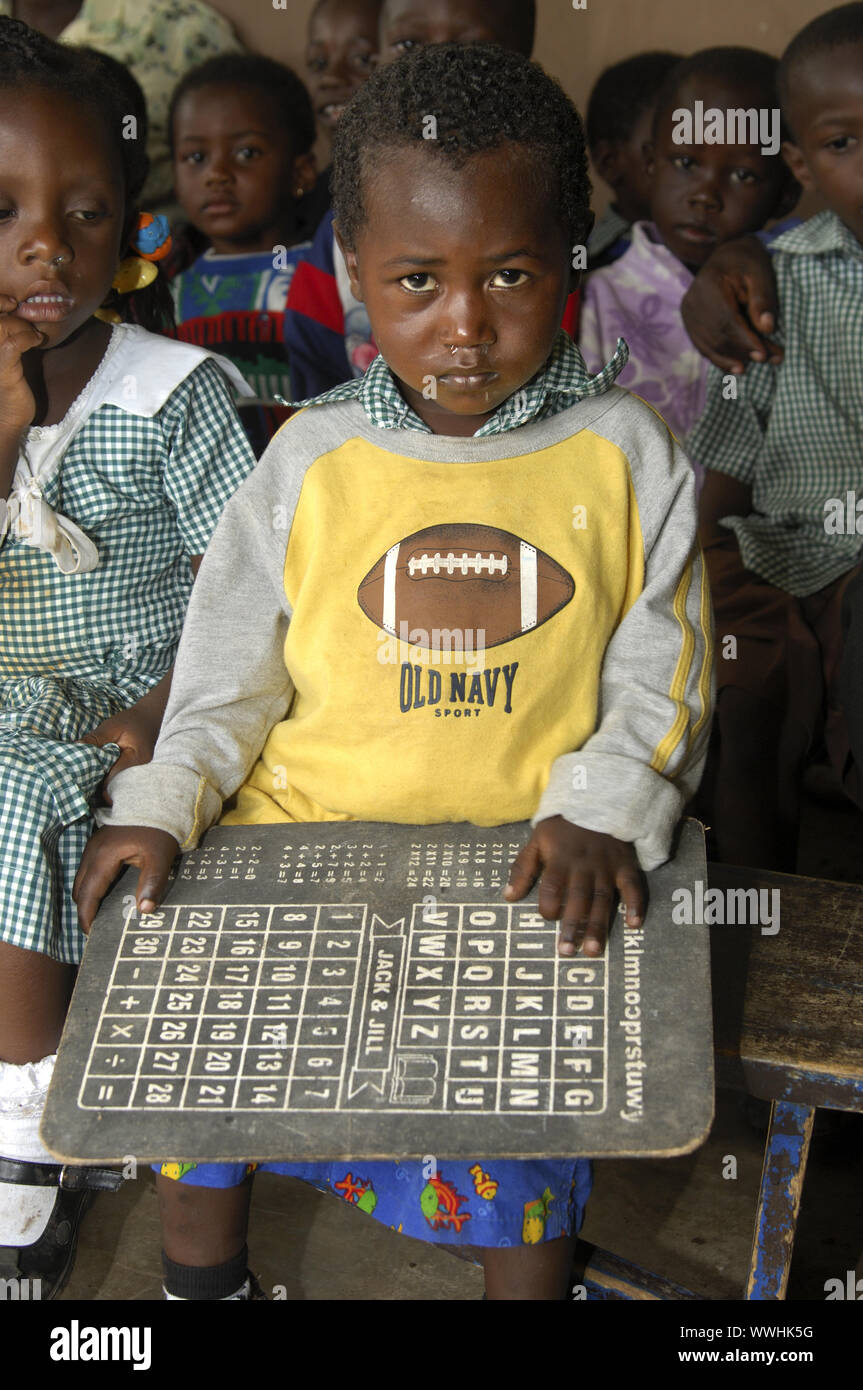 Preschool child with spelling board, Ghana Stock Photo