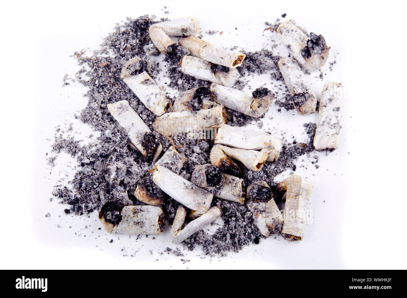 smoked and burned stump of filterless cigarettes and bright background