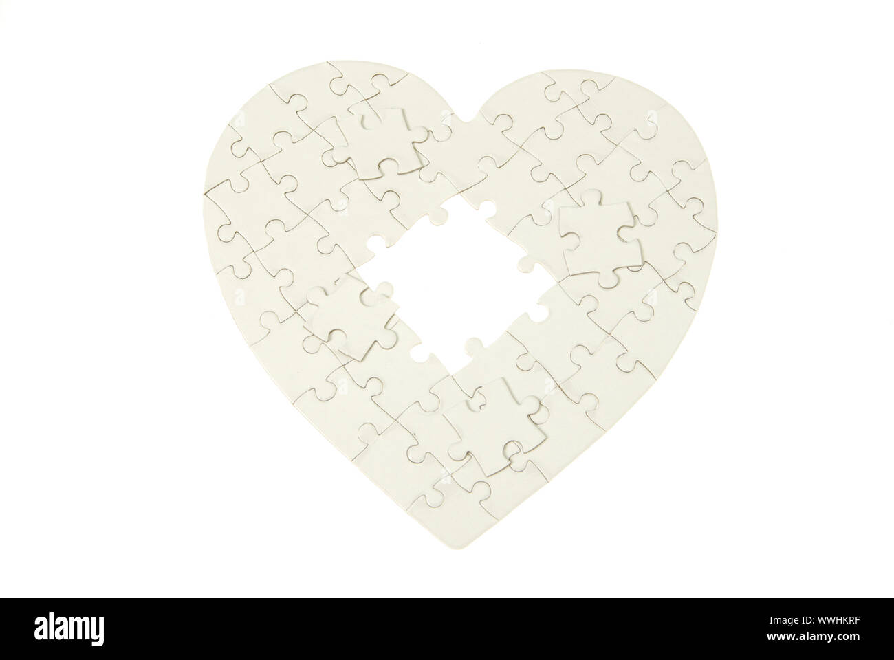 heart made from the puzzle on white Stock Photo