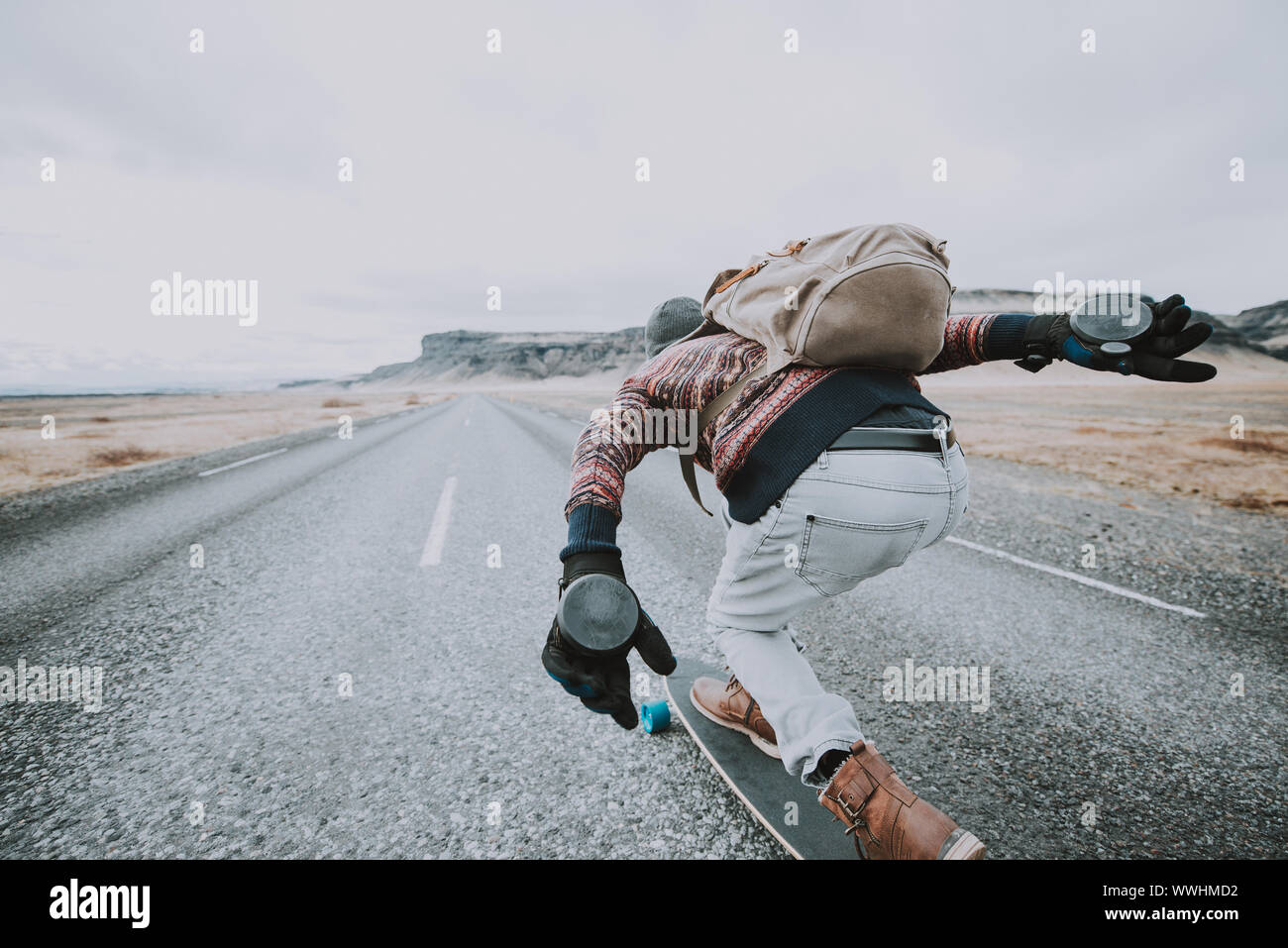 Skater traveling iceland on his longboard Stock Photo - Alamy