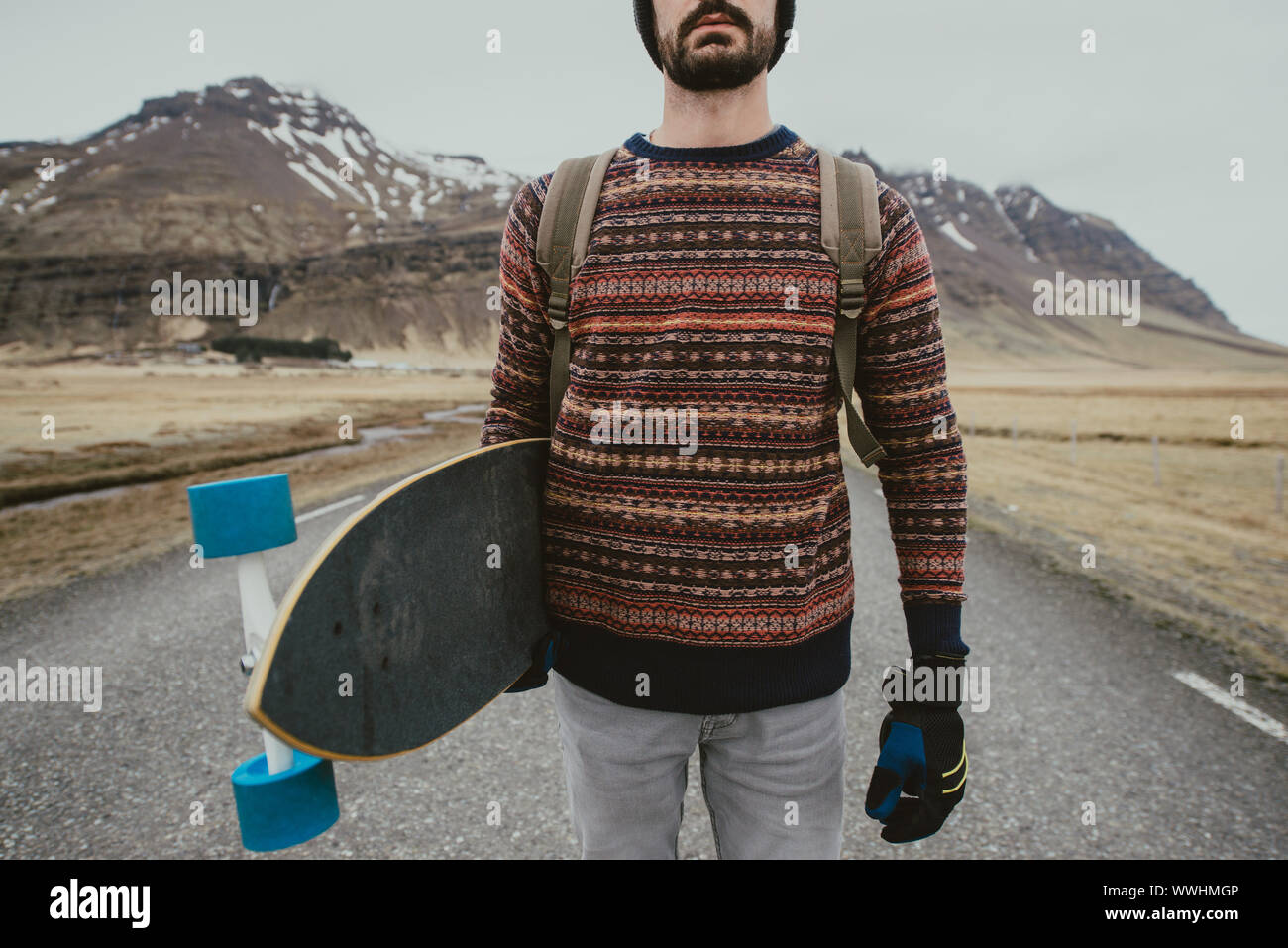 Skater traveling iceland on his longboard Stock Photo - Alamy
