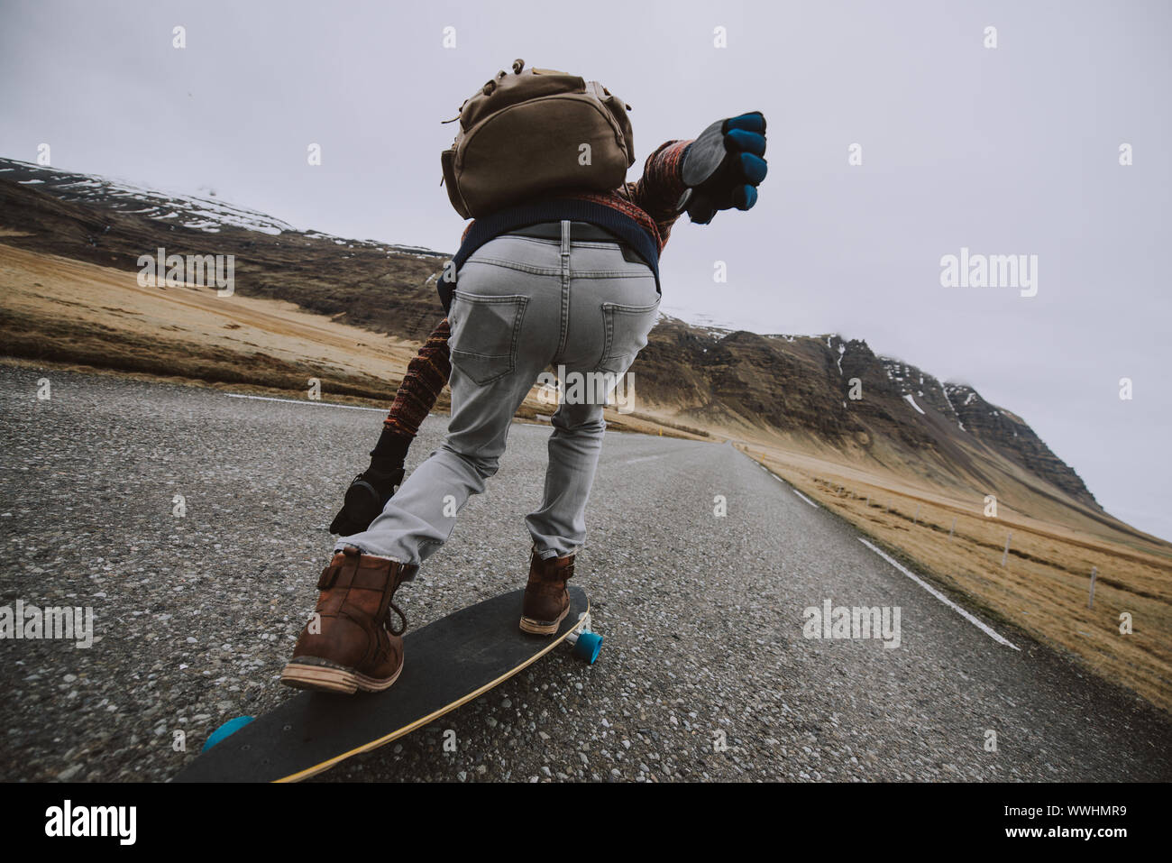 Skater traveling iceland on his longboard Stock Photo - Alamy