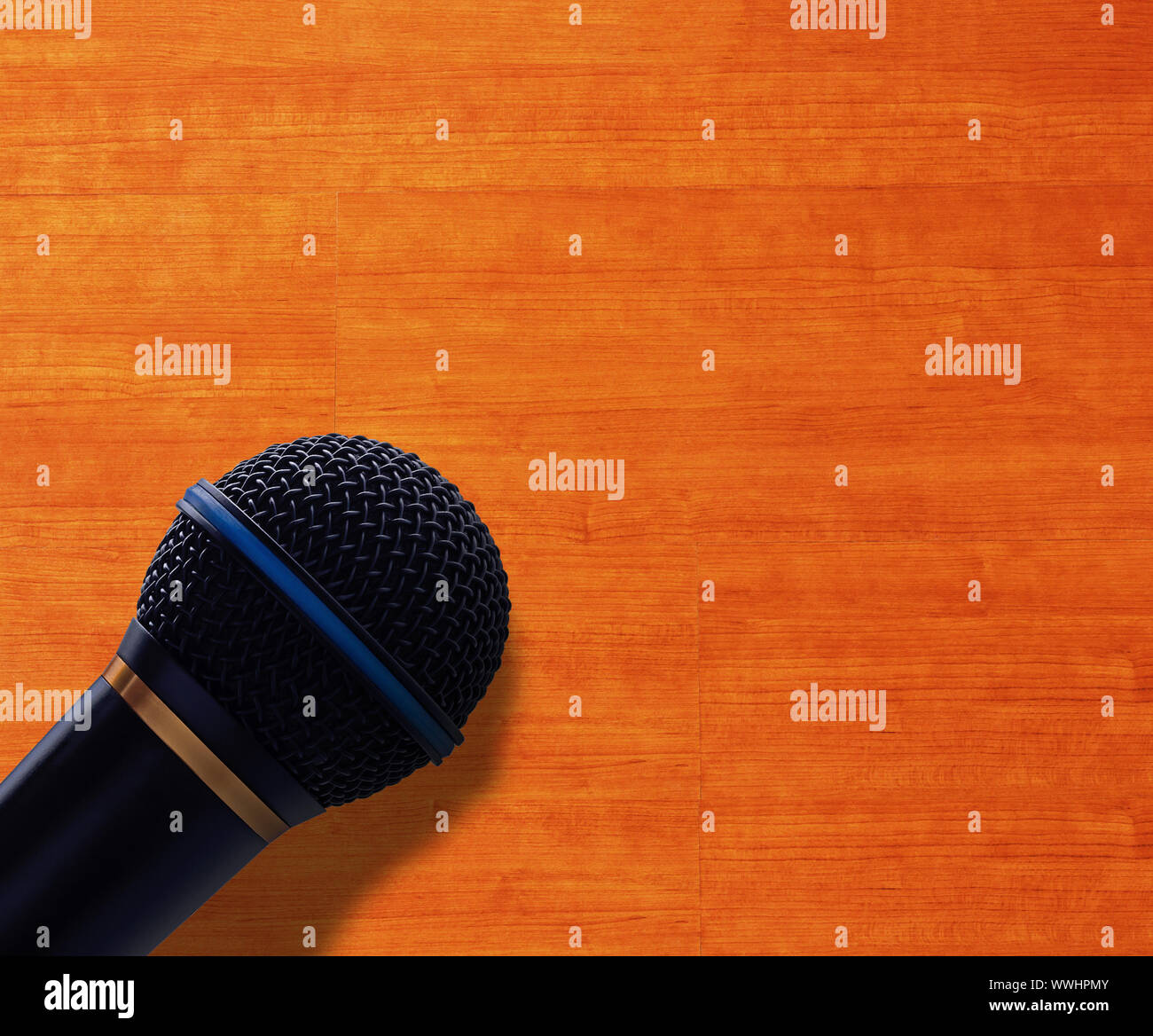 Journalist interview concept, speak microphone on wood background Stock