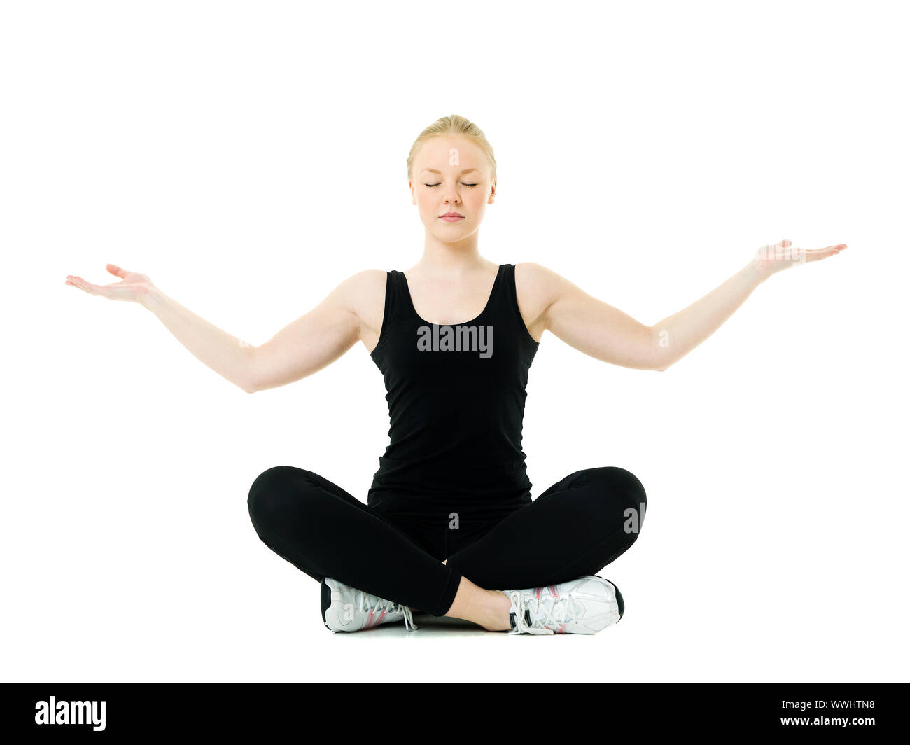 Young woman doing yoga isolated on white background Stock Photo - Alamy