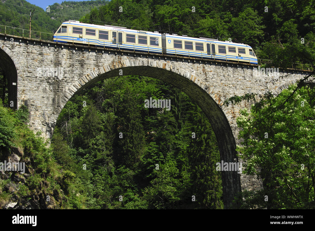 The Centovalli railway on a viaduct in Centovalli Stock Photo