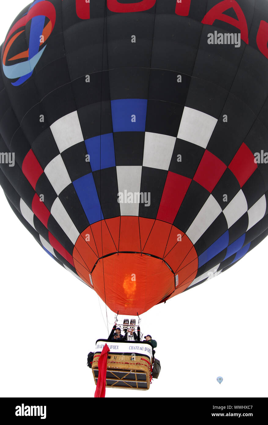 Hot air balloon with inscription and logo of the oil and gas company Total in ascent Stock Photo