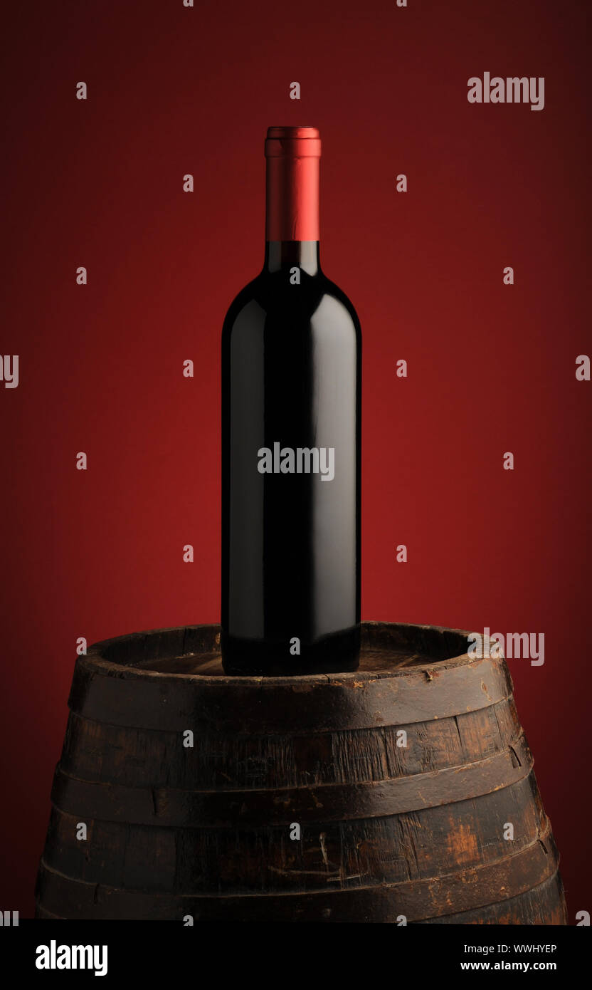 red wine bottle on wodden barrel Stock Photo Alamy