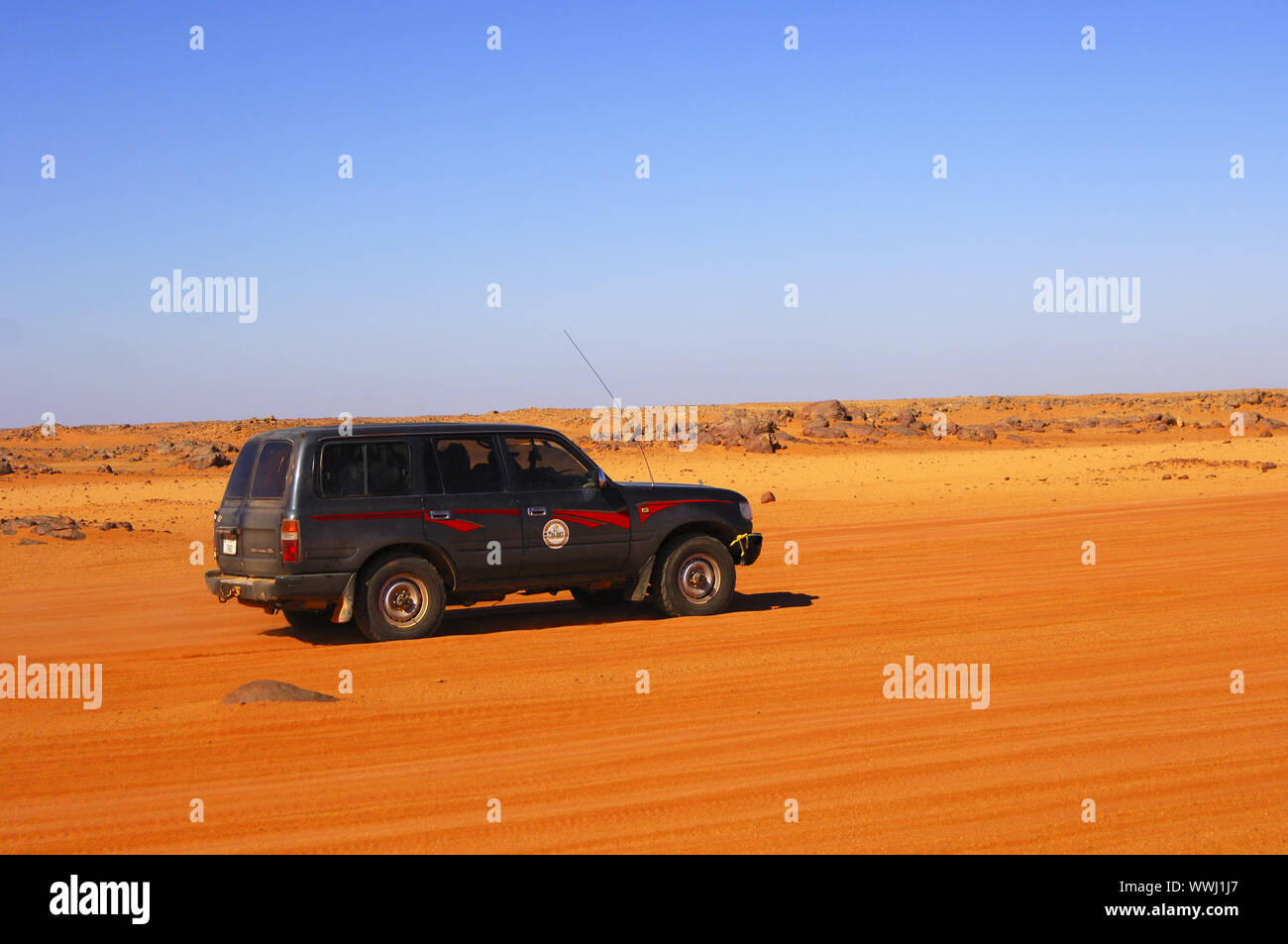 offroad vehicle on a desert road Stock Photo Alamy