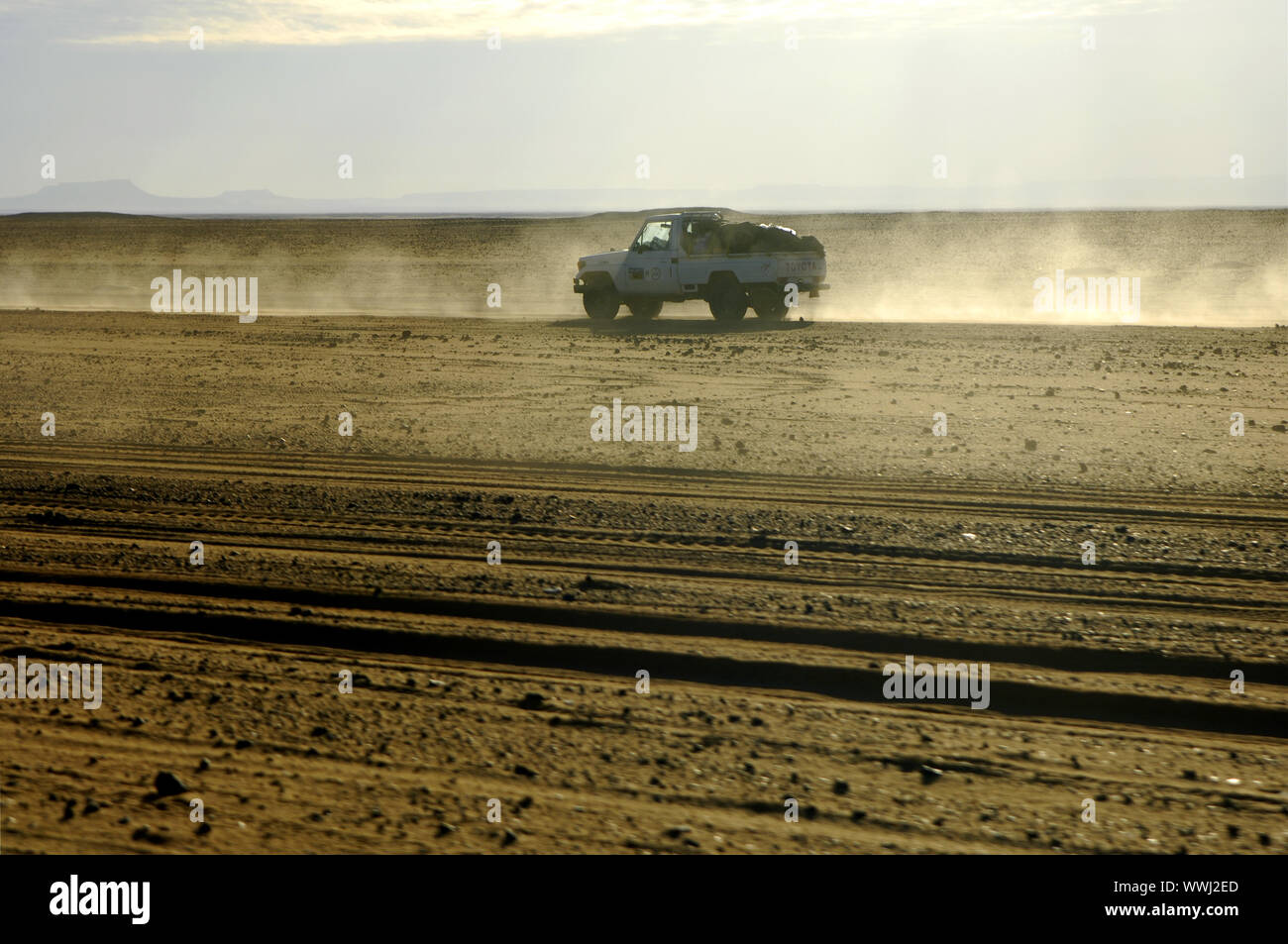 Jeep in a fast ride on a desert track Stock Photo