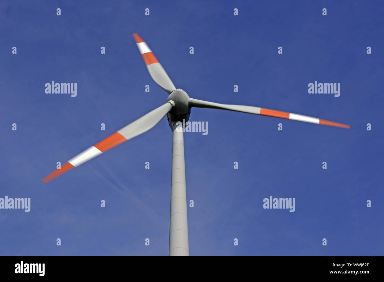 Wind turbine with rotating blades, motion blur Stock Photo Alamy