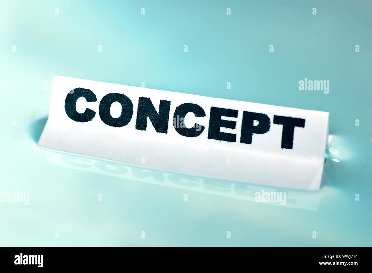 Card floating on water surface with printed word: CONCEPT Stock Photo