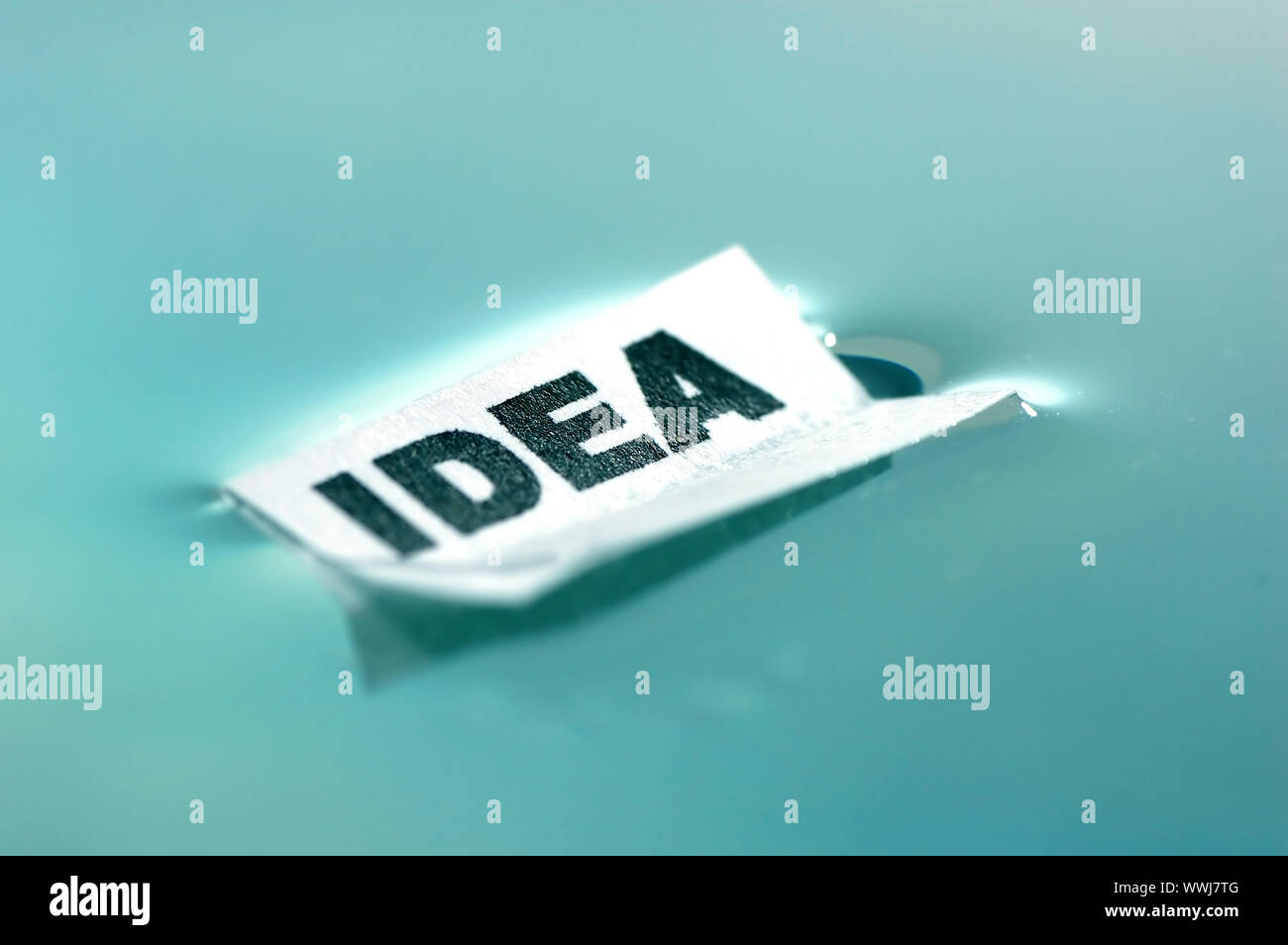 Card floating on water surface with printed word: IDEA Stock Photo