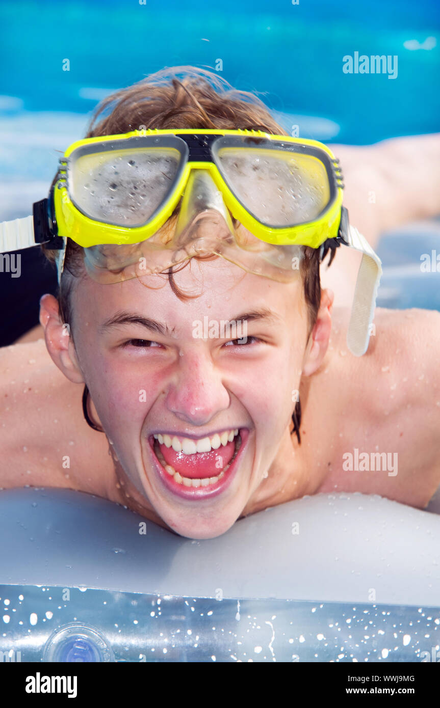 Happy playful boy swimming in a pool Stock Photo Alamy