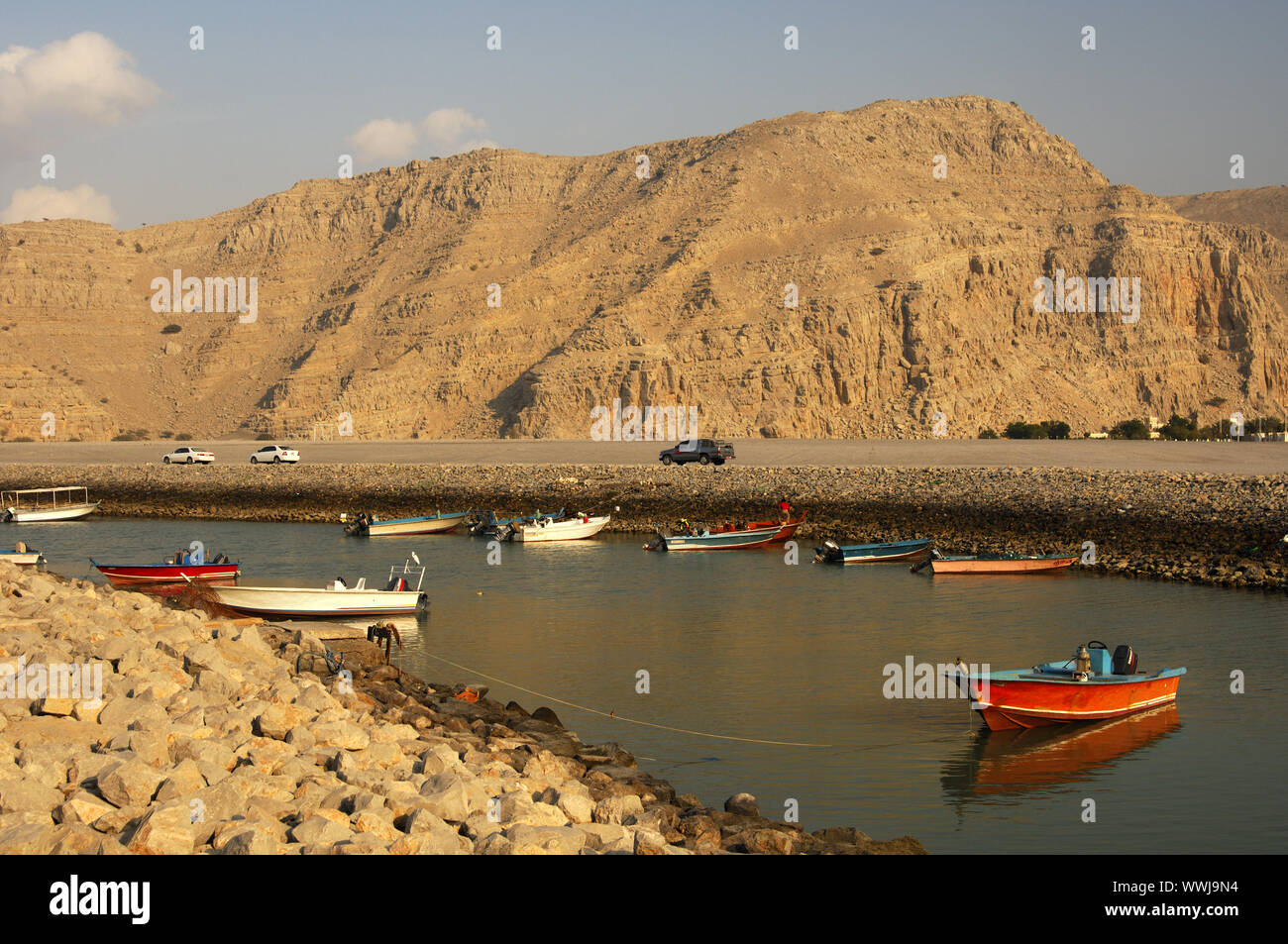 Motor boats in a protective channel, Musandam, Oman Stock Photo