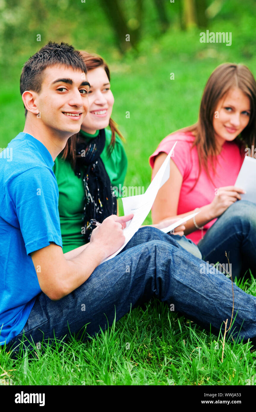 Highschool students learning together outdoor Stock Photo Alamy