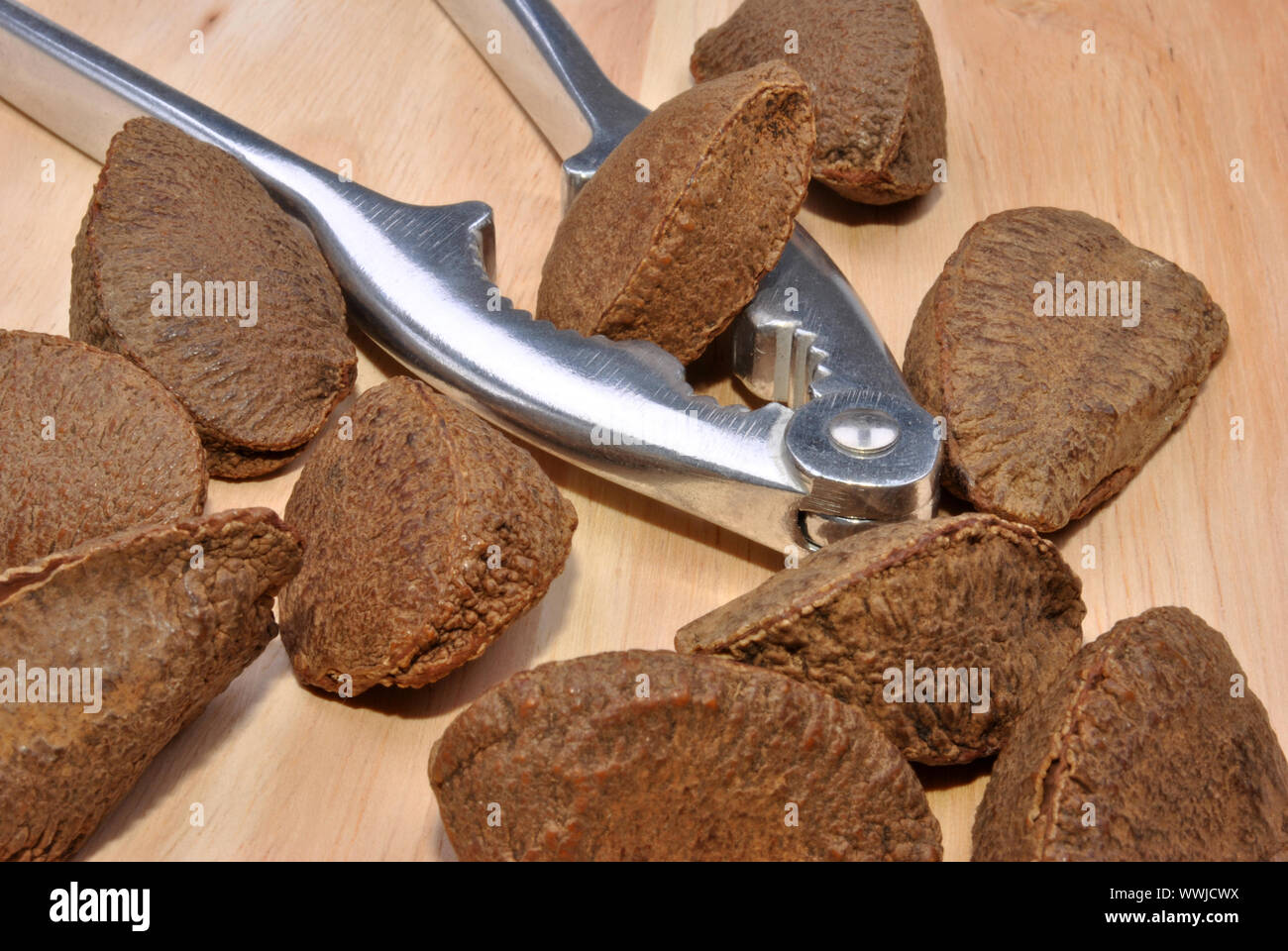 some organic brazil nuts and a nutcracker Stock Photo Alamy