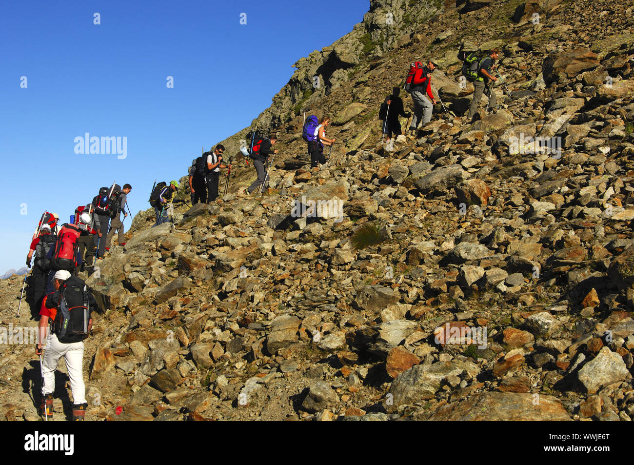 Alpinists in the scree field between Adlernest Stock Photo