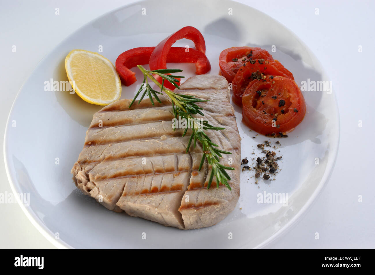 tuna steak with red paprika and lemon Stock Photo Alamy