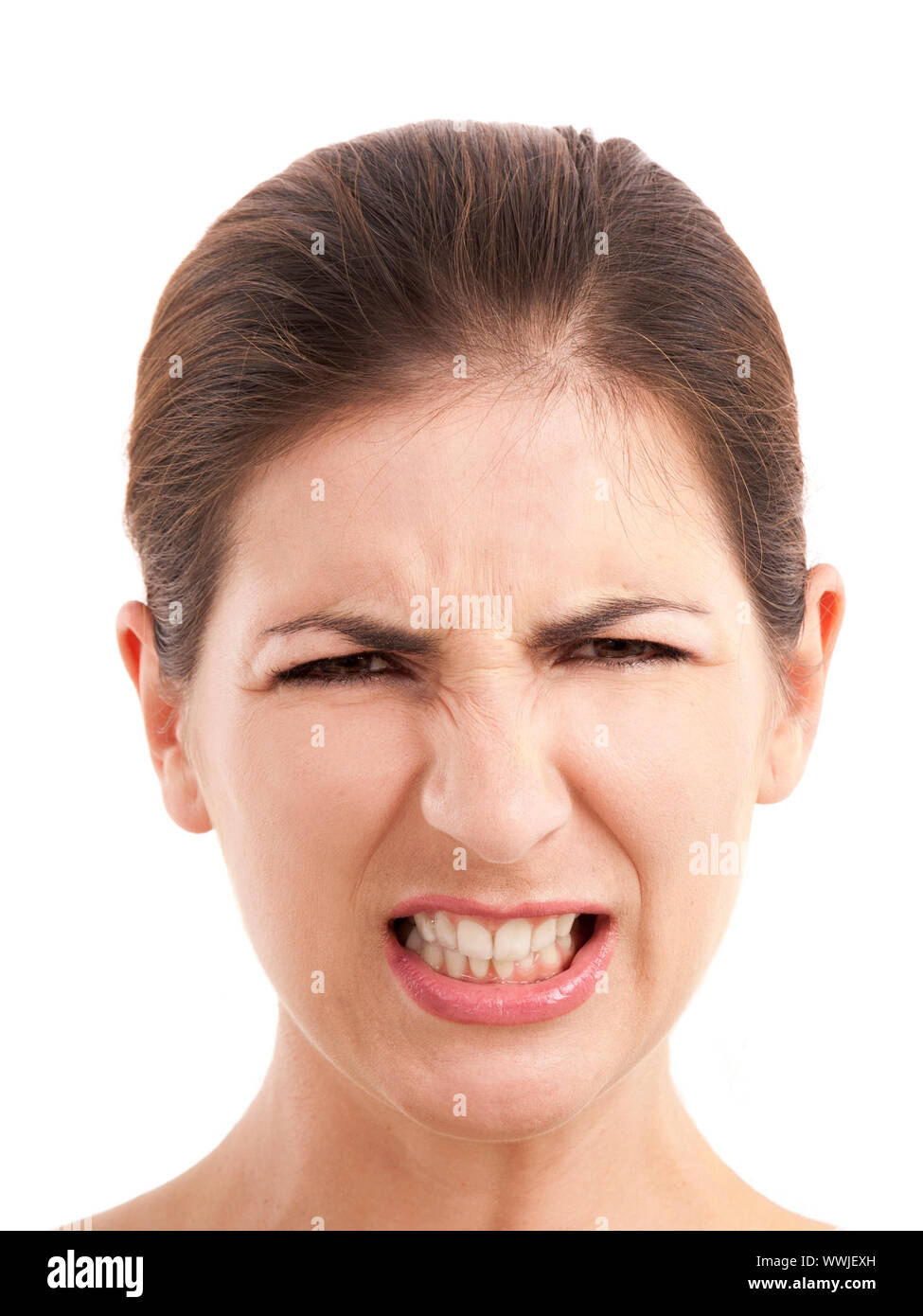 Portrait of a beautiful young woman with a upset expression, over a white background Stock Photo