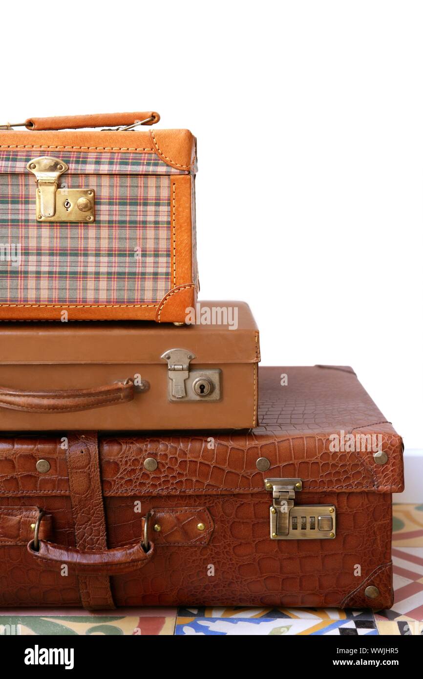 Aged old luggage leather bags vintage retro stacked baggage cases Stock