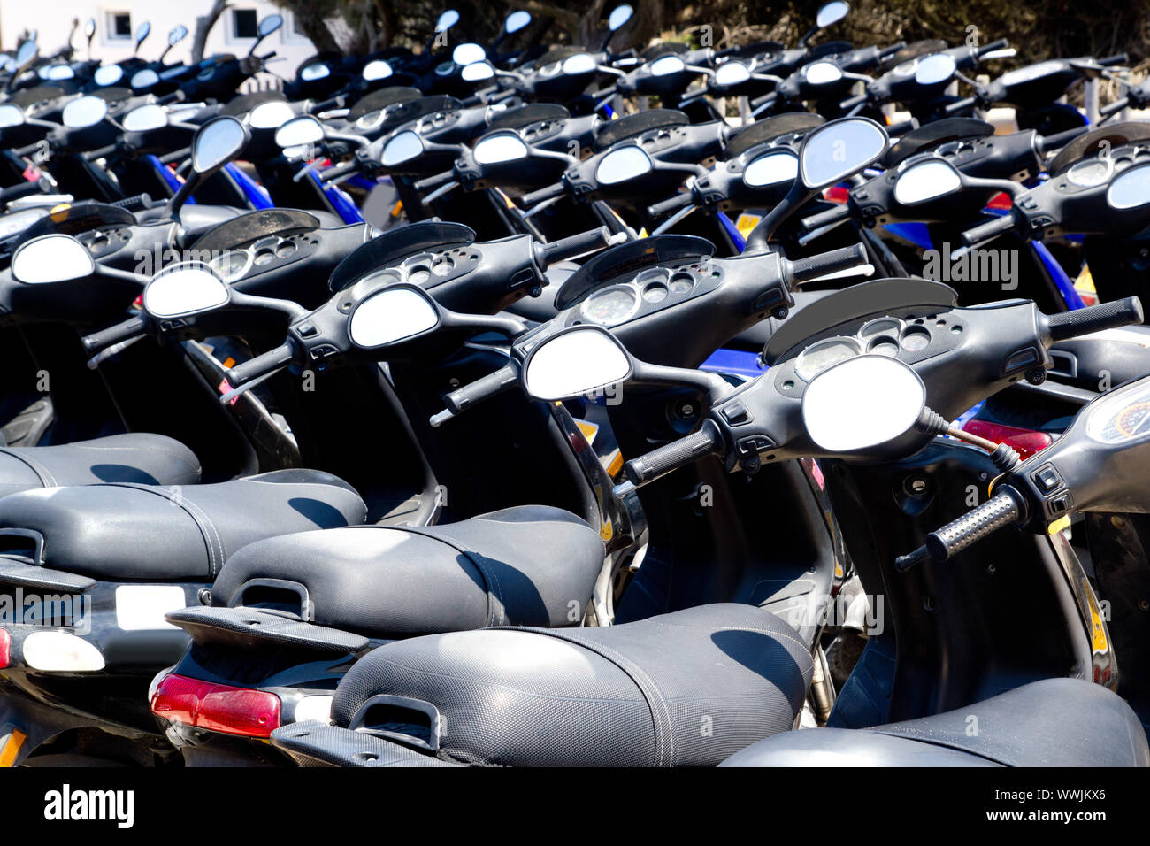 Bikes scooter pattern in renting store of Balearic islands Spain Stock Photo